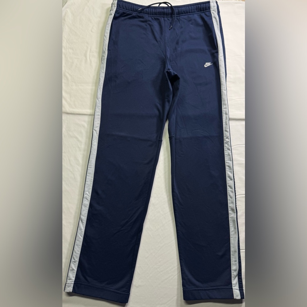 Nike Vintage Men's Blue Joggers with White Stripes
Size M.